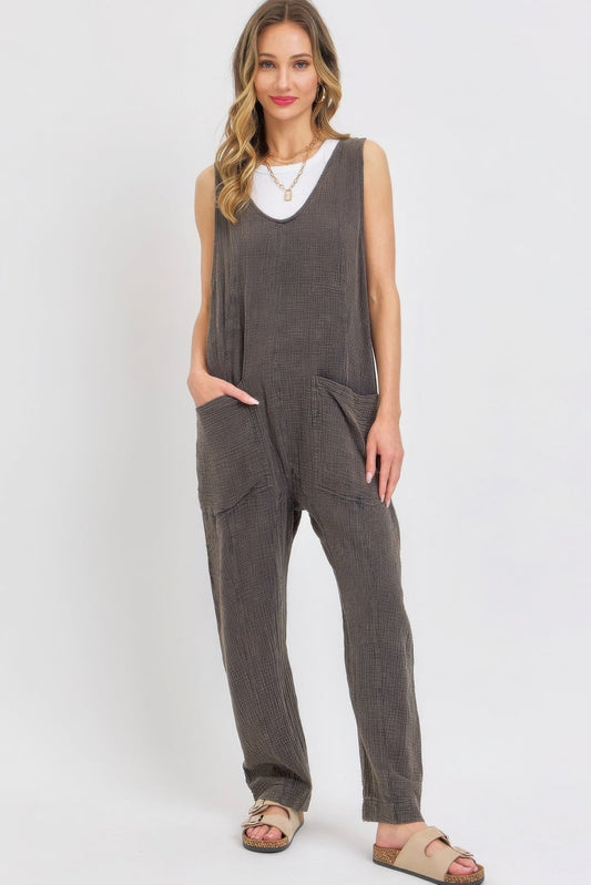 Mineral Washed Summer Jumpsuit in stone charcoal with adjustable shoulder straps and oversized pockets.