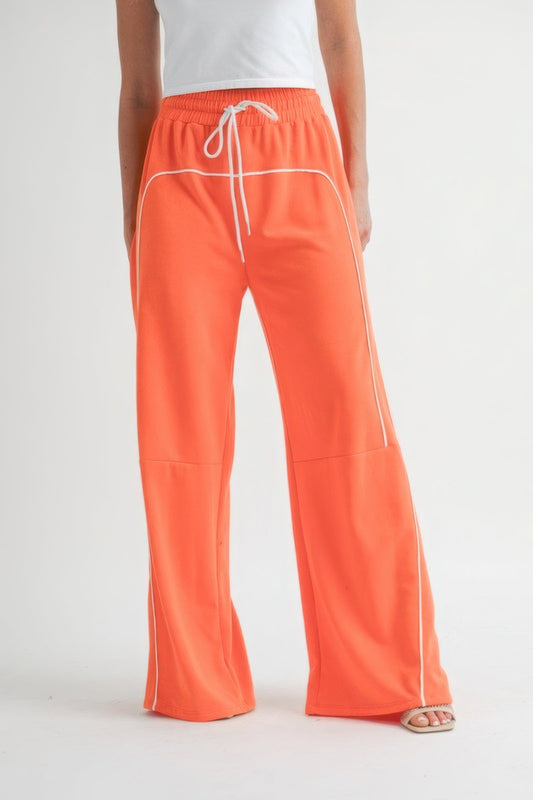 Drawstring pants in vibrant color with a relaxed fit and adjustable waist, perfect for casual comfort and style.
