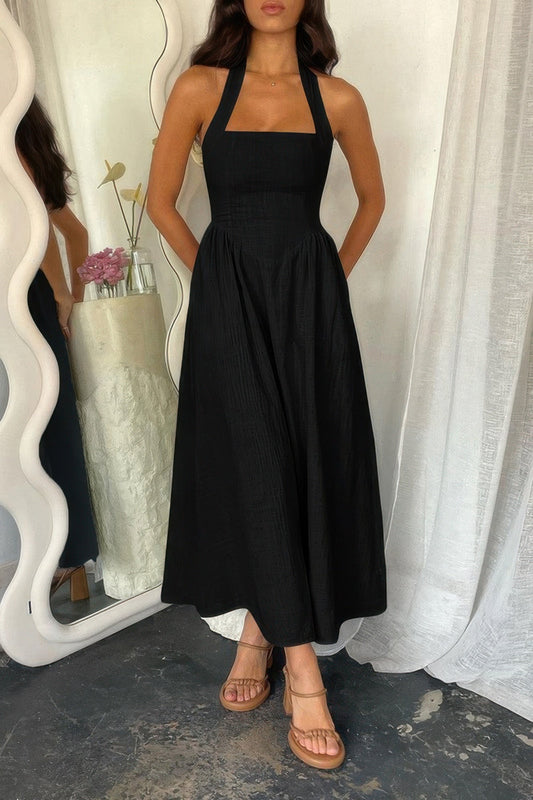 Halter solid pockets sleeveless A-line long dress in black.
