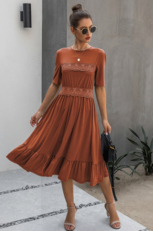 Round neck lace detail ruffle hem midi dress in rust color, featuring short sleeves and a relaxed fit.