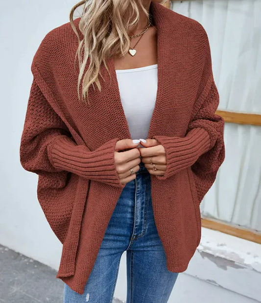 Loose knitted sweater cardigan with bat sleeves in brown, ideal for autumn layering.